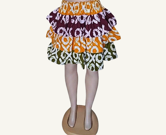 Jupe à volants étagés patchwork batik · orange · bordeaux · vert kaki · motifs XO blancs · taille élastiquée · pièce unique — M/L
